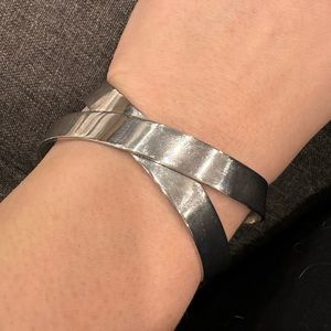 EUC crisscrossed ribbon like cuff bracelet.